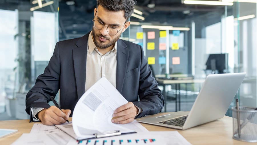 An image of a CFO performing cash flow variance analysis.