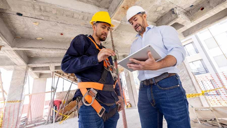 A financial manager reviewing construction data analytics with the team.