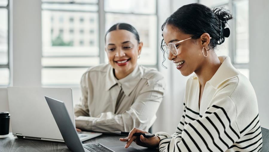 Two team members displaying workplace productivity.